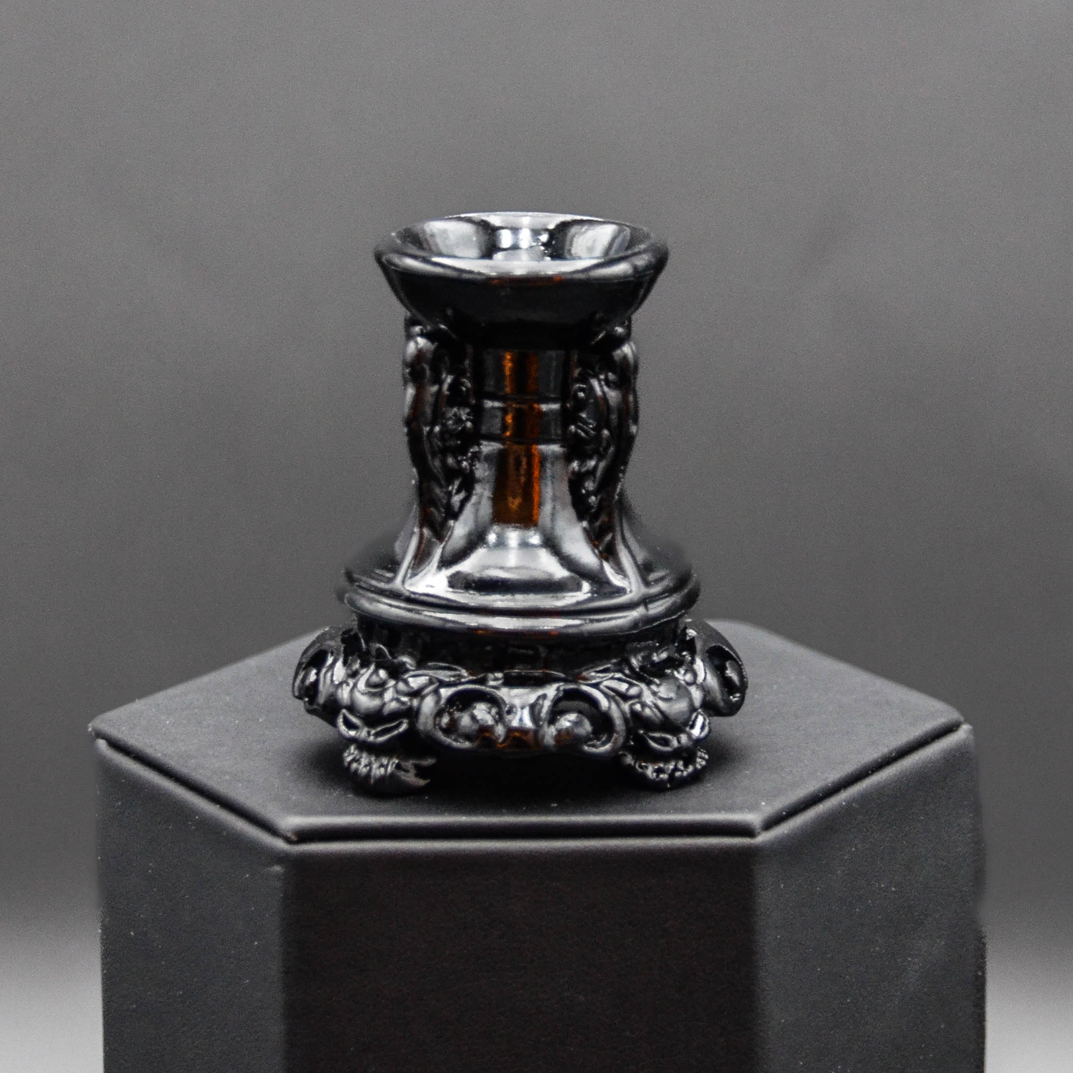 Black resin stand that will accommodate small to medium size spheres/balls.